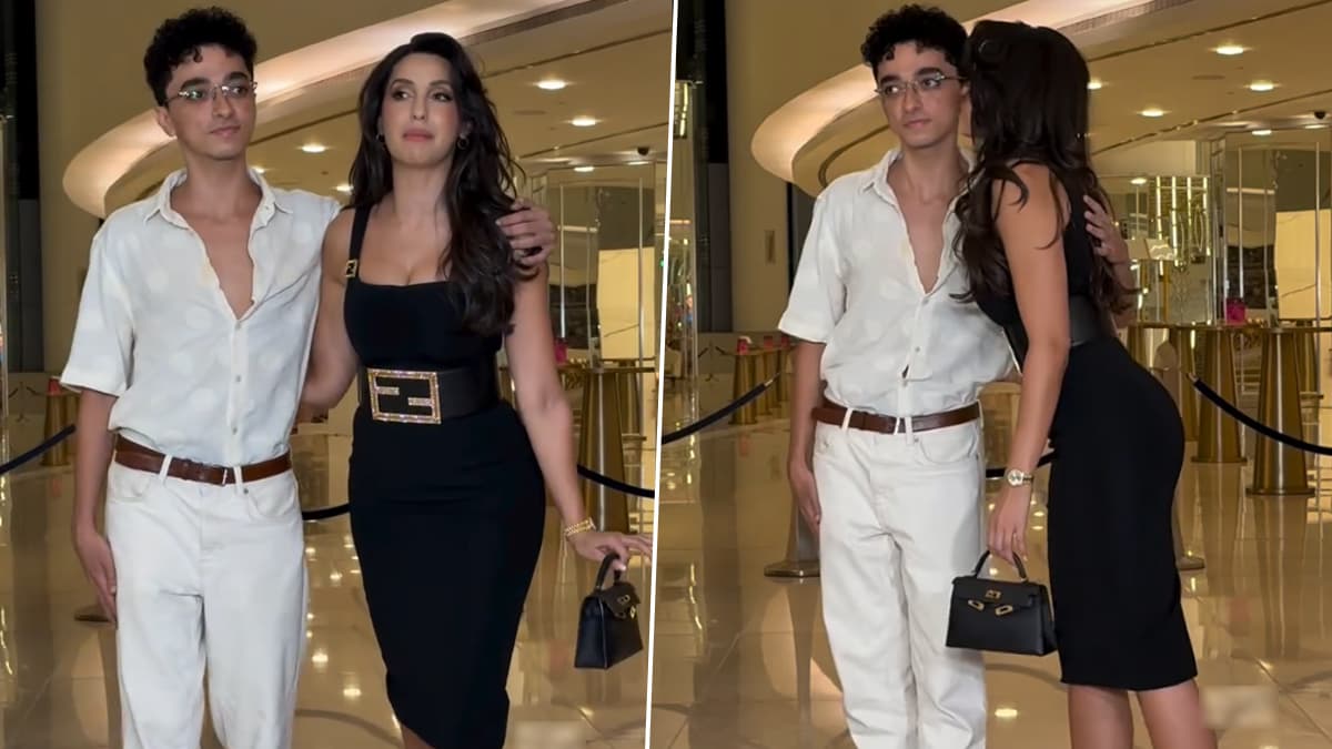 Nora Fatehi: পোজ দিয়ে ছবি তোলার সময়ে আচমকাই যুবকের গালে চুমু এঁকে দিলেন নোরা, নায়িকার পাশে কে এই রহস্যময় পুরুষ?