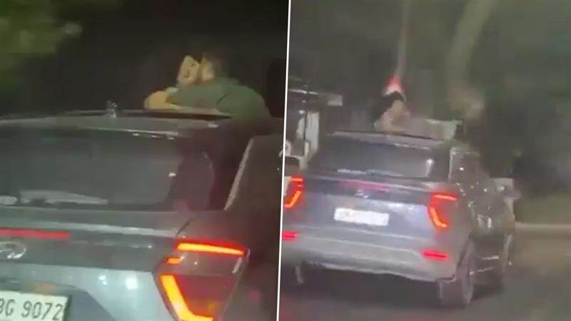 Couple Kissing Video: রাতের রাস্তায় গাড়ির সানরুফ খুলে উদ্দাম ঘনিষ্ঠতা, ঠোঁটে ঠোঁট মিশিয়ে গাঢ় চুম্বনের ঢেউ তুললেন দম্পতি, ভাইরাল ভিডিয়ো