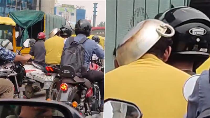Frying Pan as Helmet Video: হেলমেট নেই, ফাইন থেকে বাঁচতে তাই মাথায় ফ্রাইং প্যান চাপালেন বাইক যাত্রী, দেখুন ভিডিও