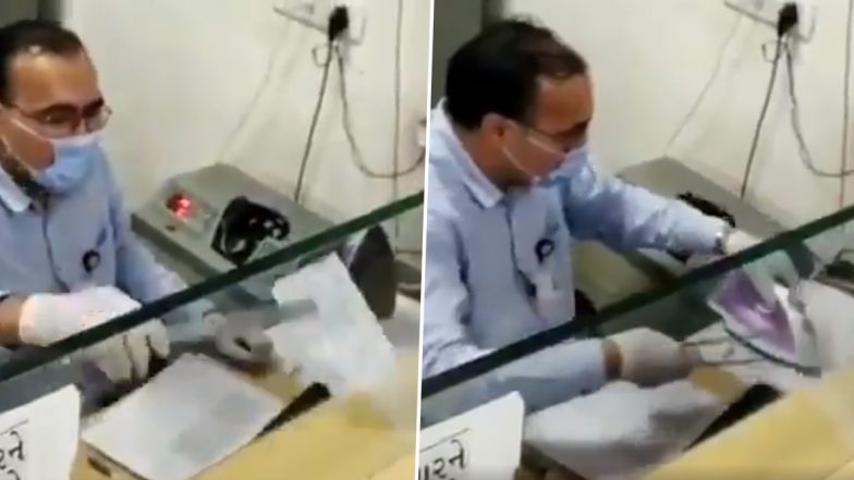 Viral Video: ইস্ত্রিতে সেঁকে চেক জীবাণুমুক্ত করছেন ব্যাঙ্ককর্মী! ভাইরাল ভিডিয়ো