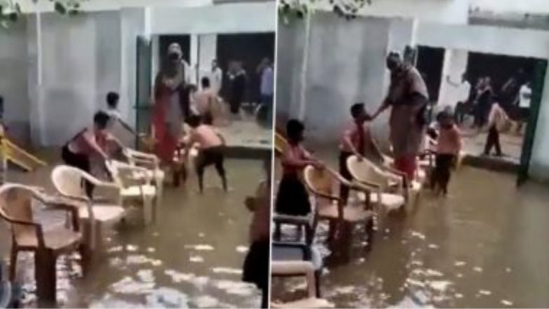 Viral Video: পড়ুয়াদের পেতে দেওয়া চেয়ারে পা দিয়ে জলমগ্ন ক্লাসঘর পেরিয়ে গেলেন শিক্ষিকা, ভাইরাল ভিডিও