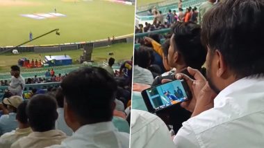 Fan Watching IPL in Phone in Stadium: স্টেডিয়ামে বসেই ফোনে আইপিএল ম্যাচ দেখছেন এক ব্যক্তি, দেখুন নেটপাড়ায় হাসির রোল